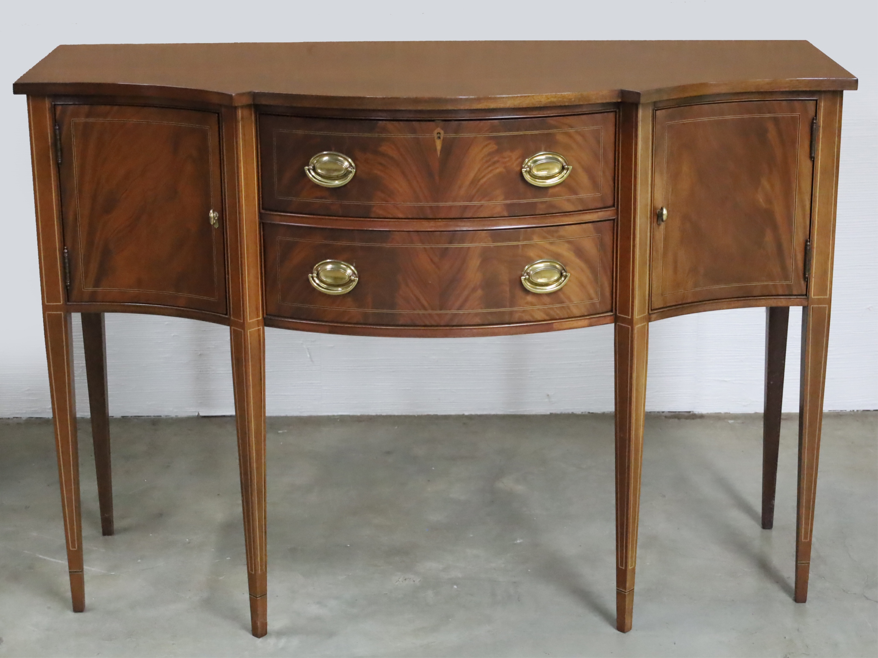 Appraisal: HISTORIC JAMES RIVER PLANTATION SIDEBOARD American Hepplewhite style mahogany serpentine