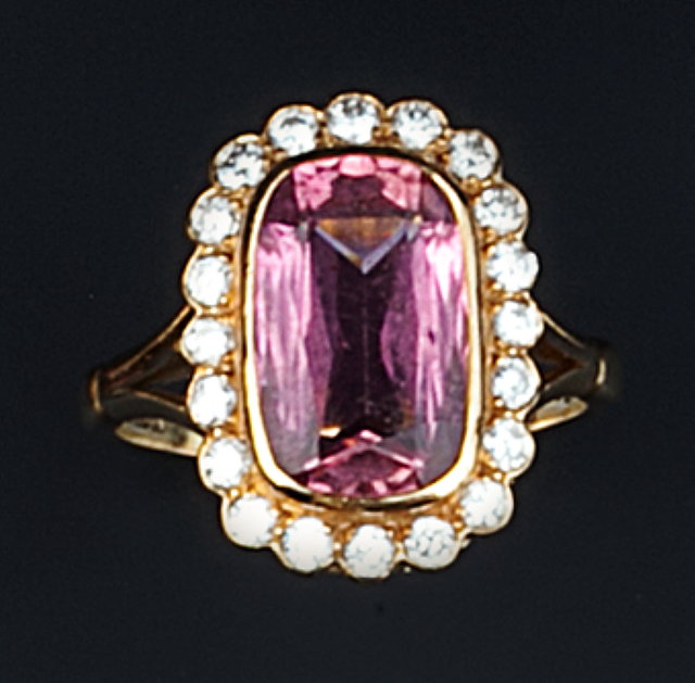 Appraisal: A PINK TOURMALINE AND DIAMOND CLUSTER RING the cushion-shaped pink