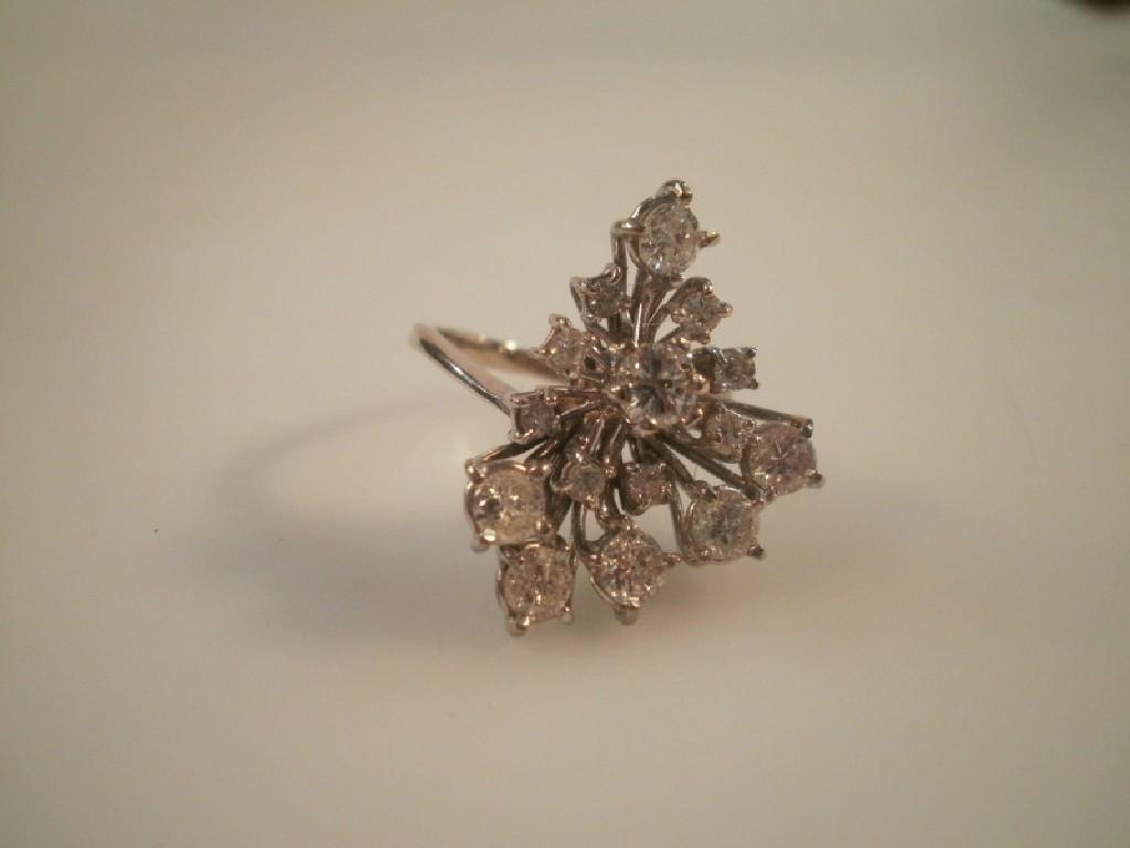 Appraisal: An abstract design diamond cluster set ring total diamond weight