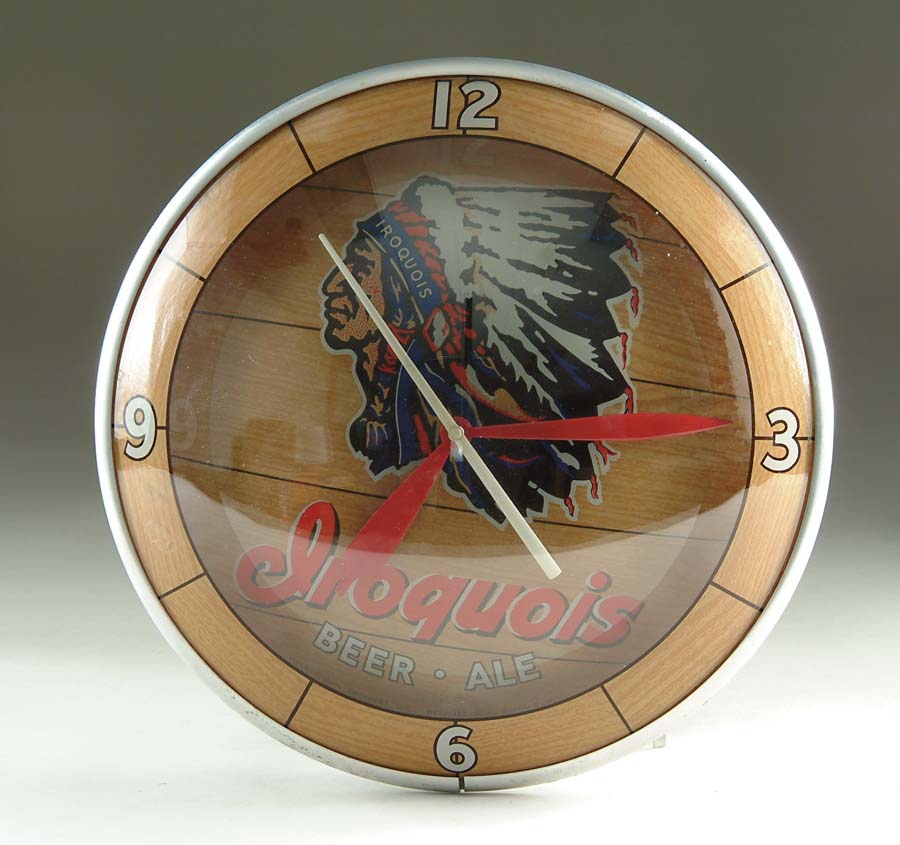 Appraisal: ORIGINAL IROQUOIS BEER AND ALE BACK-LIT CLOCK A double-bubble clock