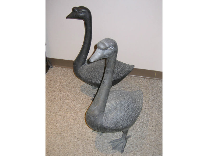 Appraisal: PAIR BRONZE GARDEN GEESE realistically modeled h Estimate -