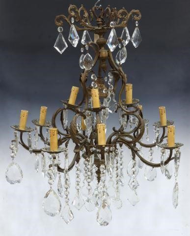 Appraisal: Italian bronze and crystal twelve-light chandelier th c undulating foliate