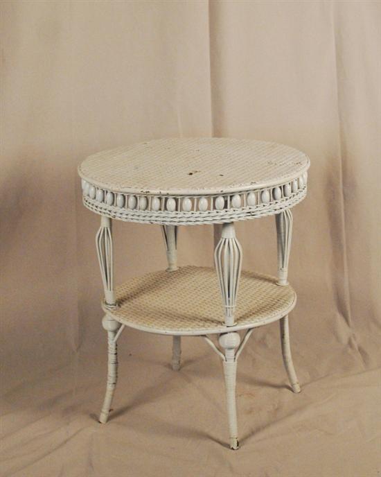 Appraisal: A Heywood-Wakefield Two-tier Round Wicker Stand painted white with a