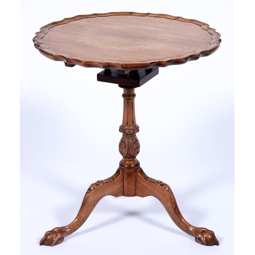 Appraisal: A carved mahogany tripod table in George II style with