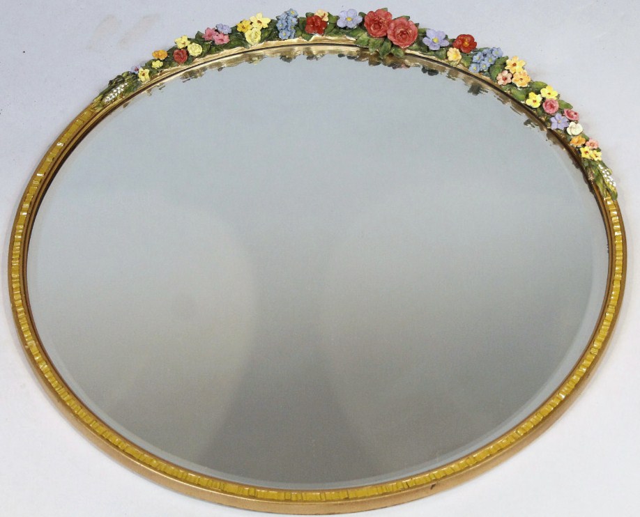 Appraisal: A thC Spanish style mirror the circular bevelled glass surmounted