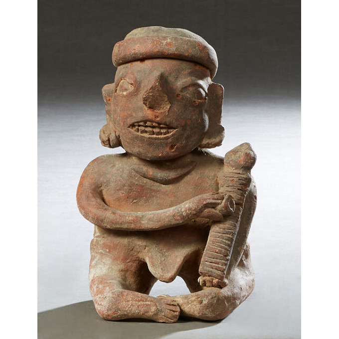 Appraisal: Pre-Columbian Pottery Figure of a seated man using a grater