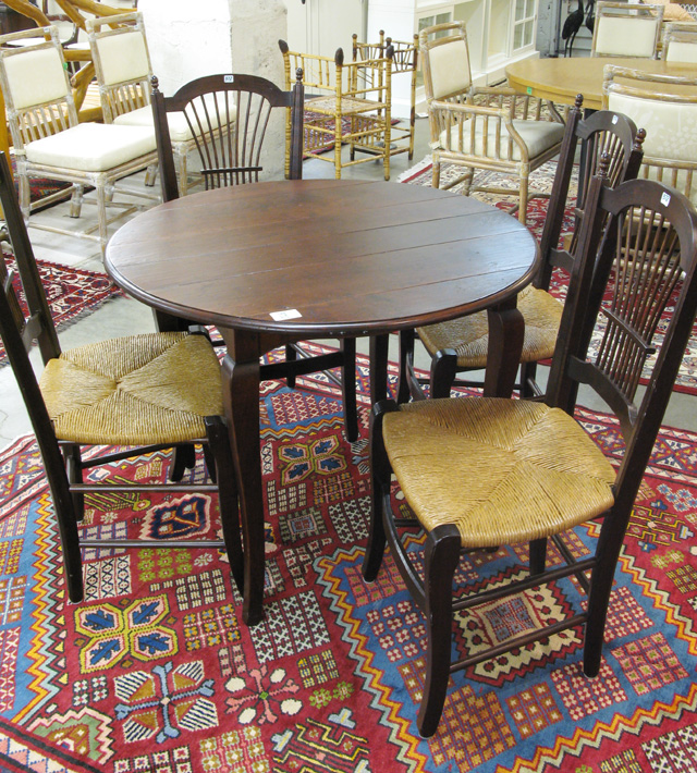 Appraisal: CAFE TABLE AND CHAIR SET American antique reproduction the set