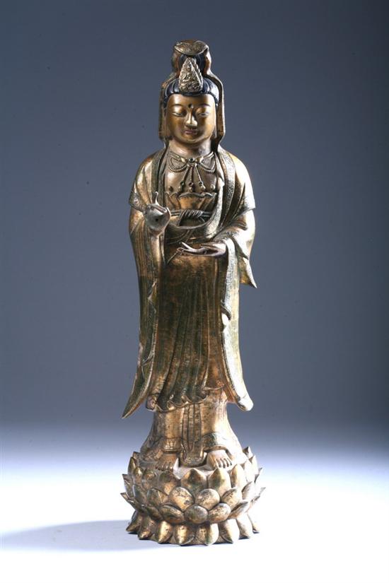 Appraisal: CHINESE GILT BRONZE FIGURE OF GUANYIN Standing on lotus plinth