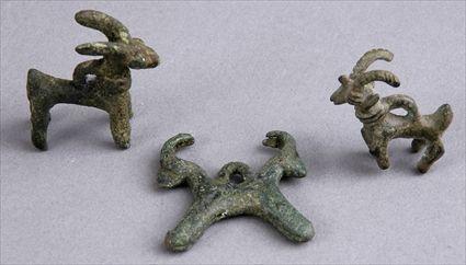 Appraisal: THREE LURISTAN BRONZE GOAT-FORM AMULETS All approx in Provenance Property