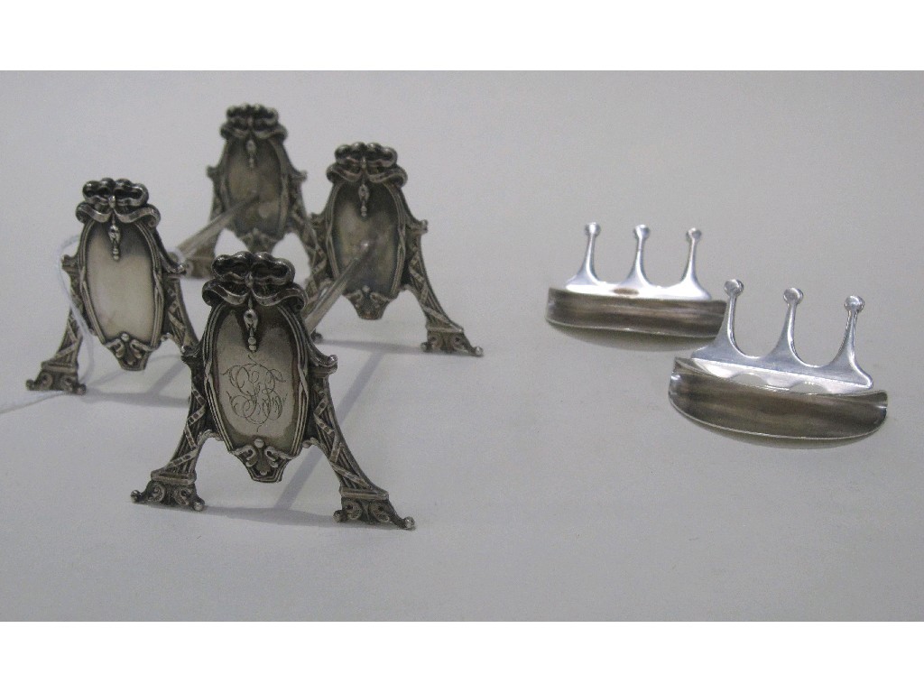 Appraisal: Lot comprising pair of silver plated knife rests and a