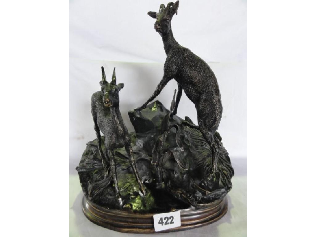 Appraisal: A bronze group showing mountain goats indistinctly signed