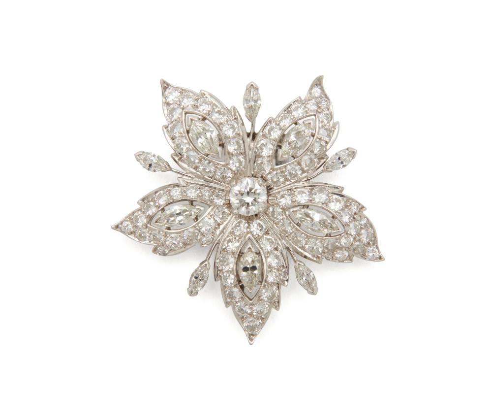 Appraisal: Platinum and Diamond Brooch the floral-form starburst design centering a