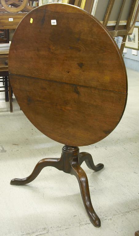 Appraisal: Early th century elm snap top tripod circular table supported