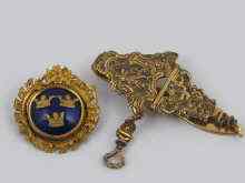 Appraisal: A gilt metal and blue enamel Swedish military insignia together