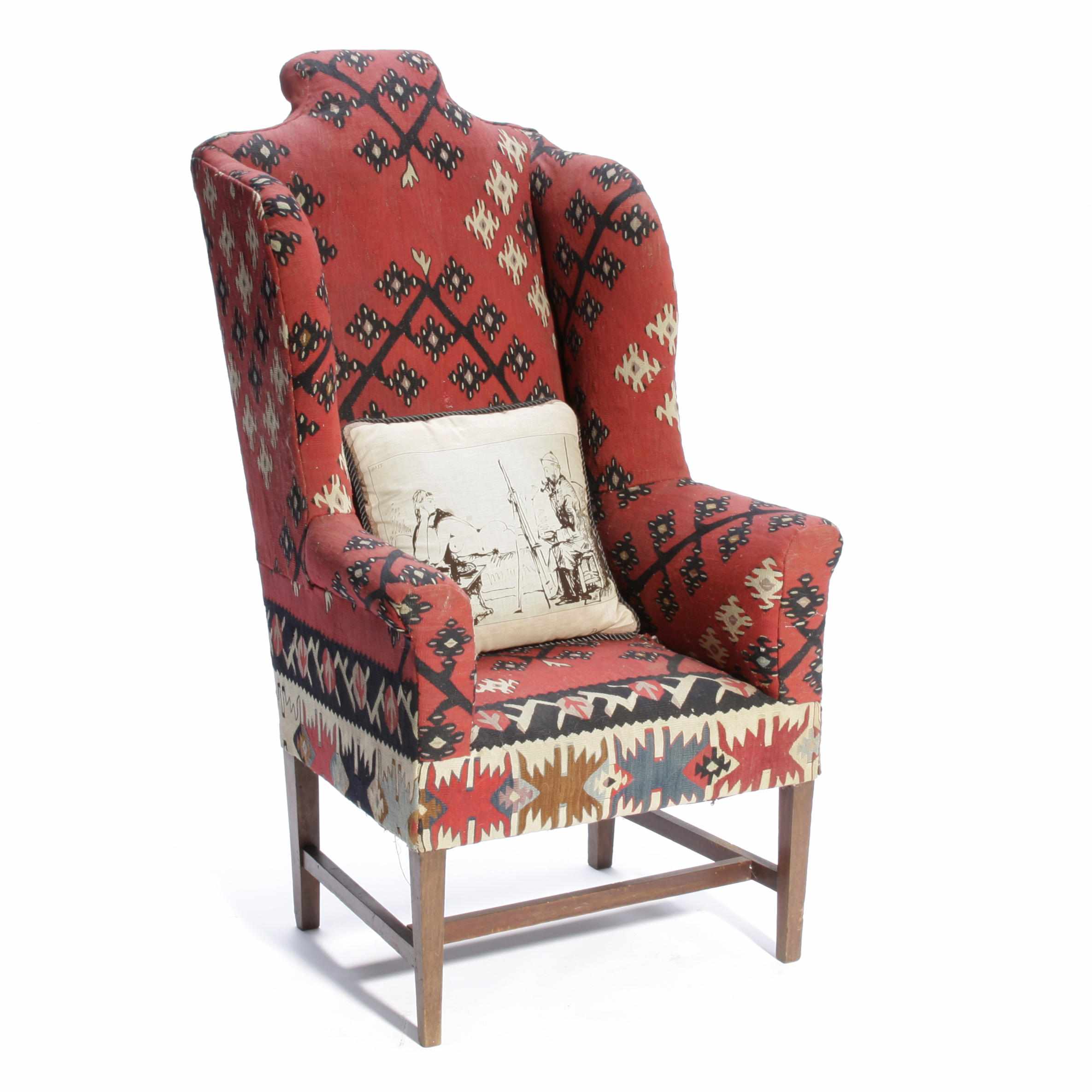 Appraisal: A Kilim upholstered wing armchair height in width in depth