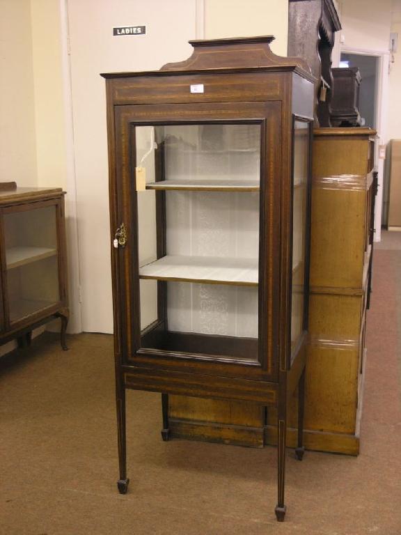 Appraisal: An Edwardian inlaid mahogany display cabinet single glazed door enclosing