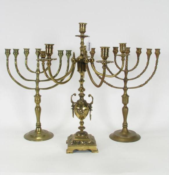 Appraisal: Group of brass candlesticks including two seven-branch menorah and a