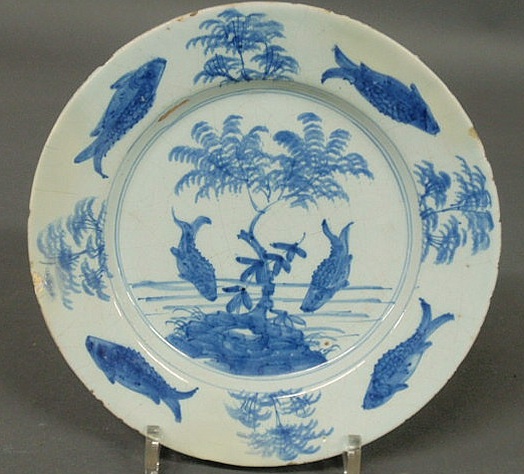 Appraisal: English blue and white Delft plate th c with tin