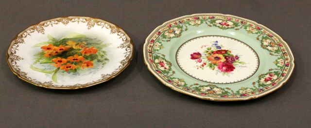 Appraisal: Two Royal Doulton cabinet plates painted with floral bouquets one