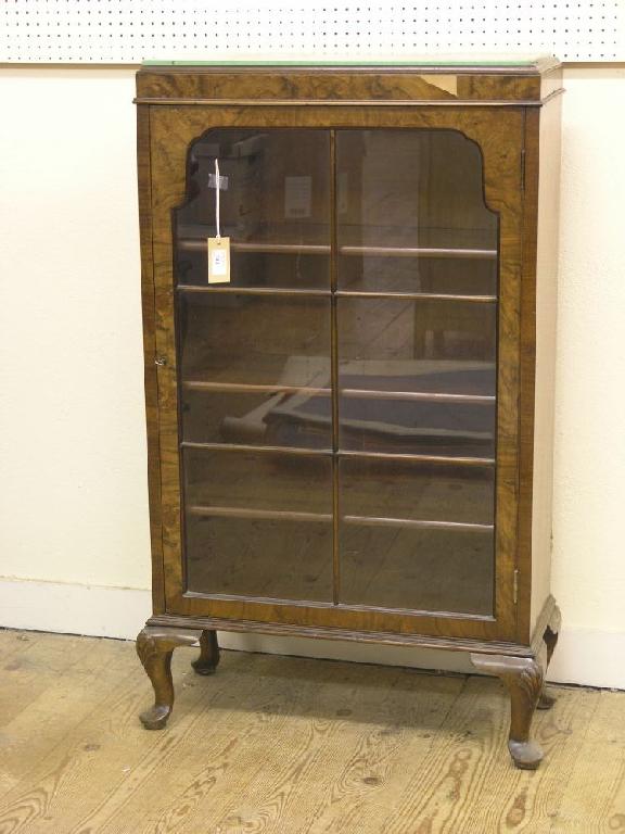 Appraisal: A burr walnut veneered display cabinet three adjustable shelves enclosed