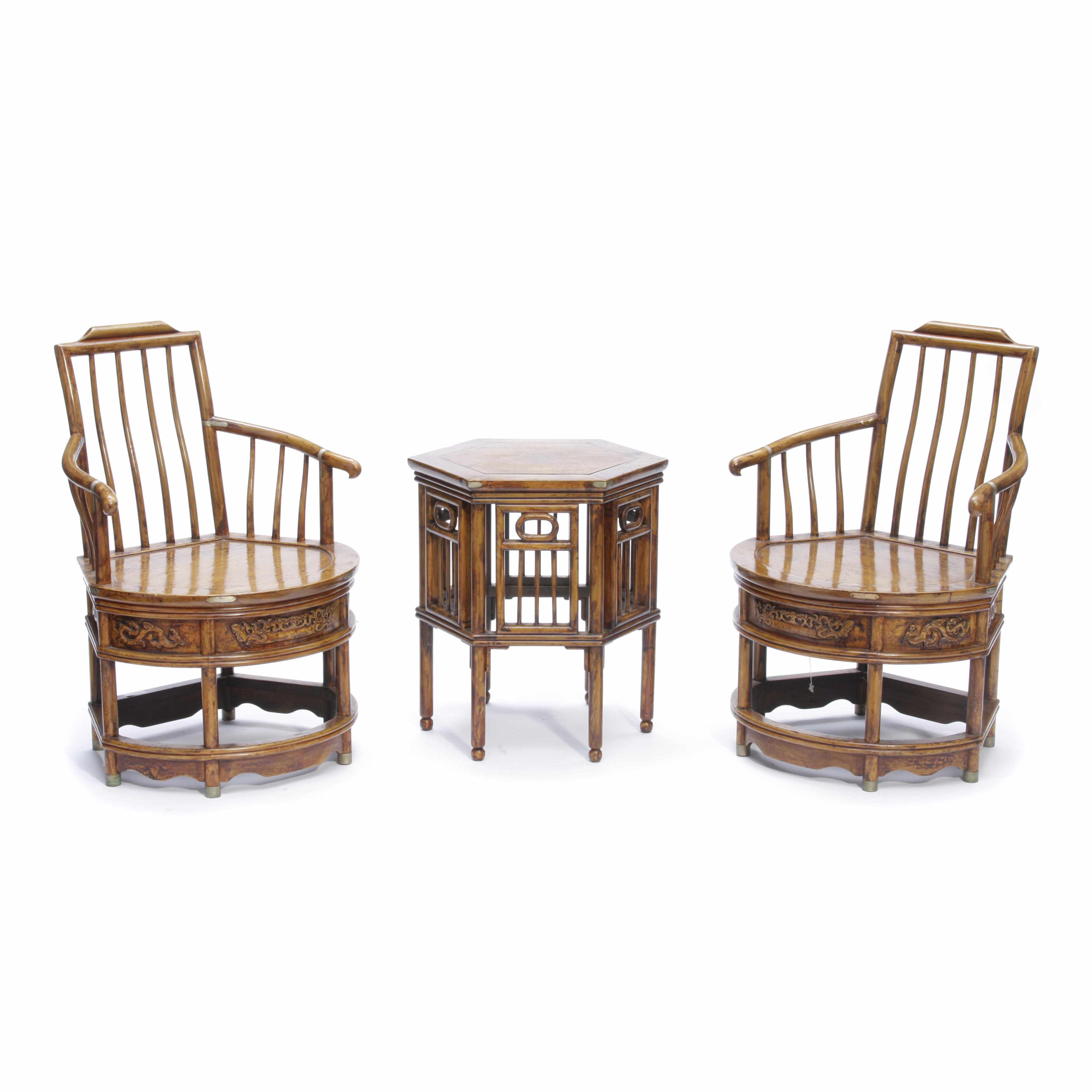 Appraisal: A pair of Chinese hardwood armchairs Together with a hexagonal