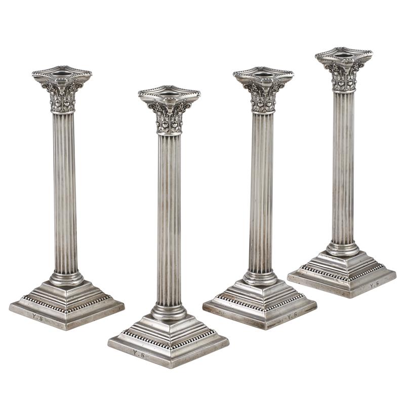 Appraisal: FOUR CORINTHIAN COLUMN STERLING CANDLESTICKS Condition Report Some dents wear