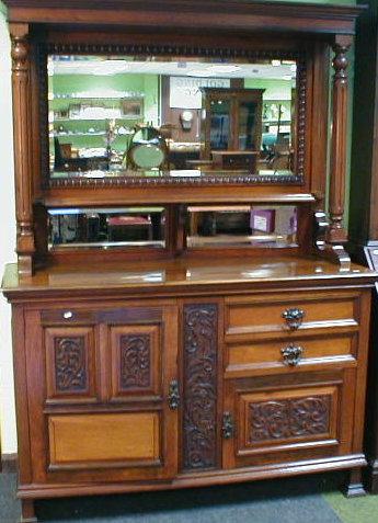 Appraisal: A late Victorian walnut mirror back dresser with moulded cornice