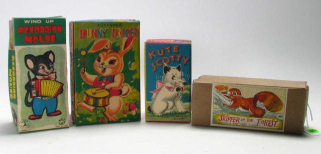 Appraisal: Group of four vintage Japanese mechanical wind-up toys including Kute