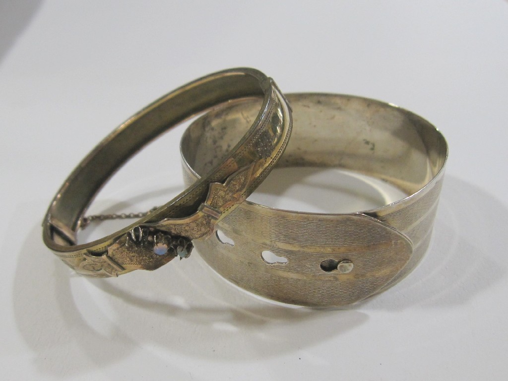 Appraisal: Lot comprising silver buckle bangle and an ct gold engraved