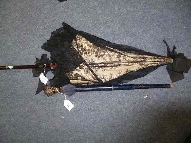 Appraisal: A LATE TH EARLY TH CENTURY PARASOL the red spherical