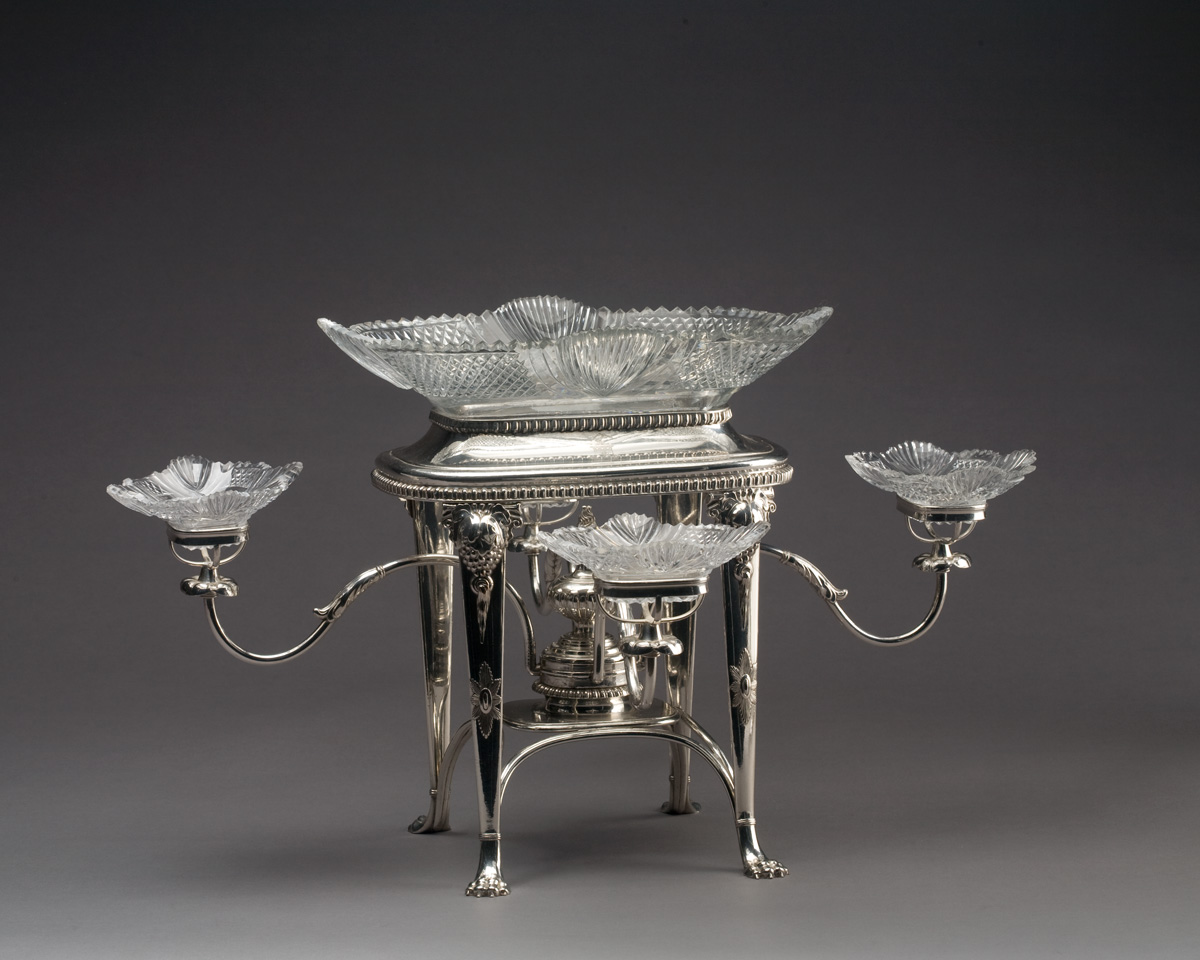 Appraisal: REGENCY STYLE SILVERPLATE FIVE-BASKET EPERGNE The glass bowl cut in