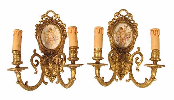 Appraisal: A pair of two light porcelain and bronze sconces height