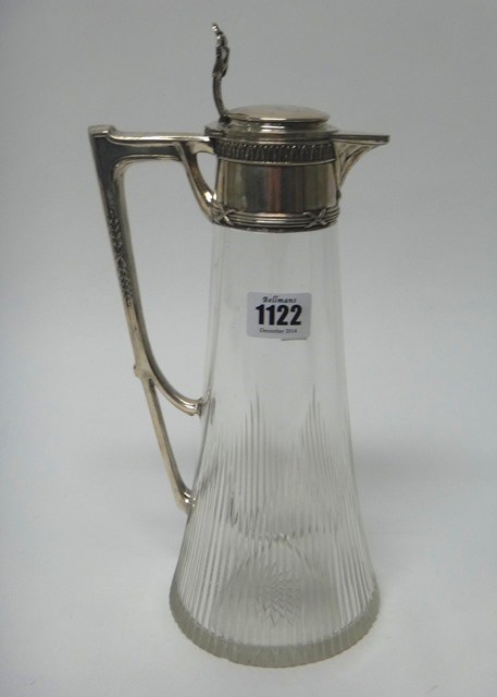 Appraisal: A German white coloured metal mounted glass claret jug the