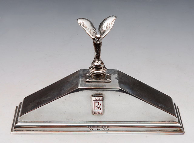 Appraisal: A SILVER DESK STAND in the form of a Rolls