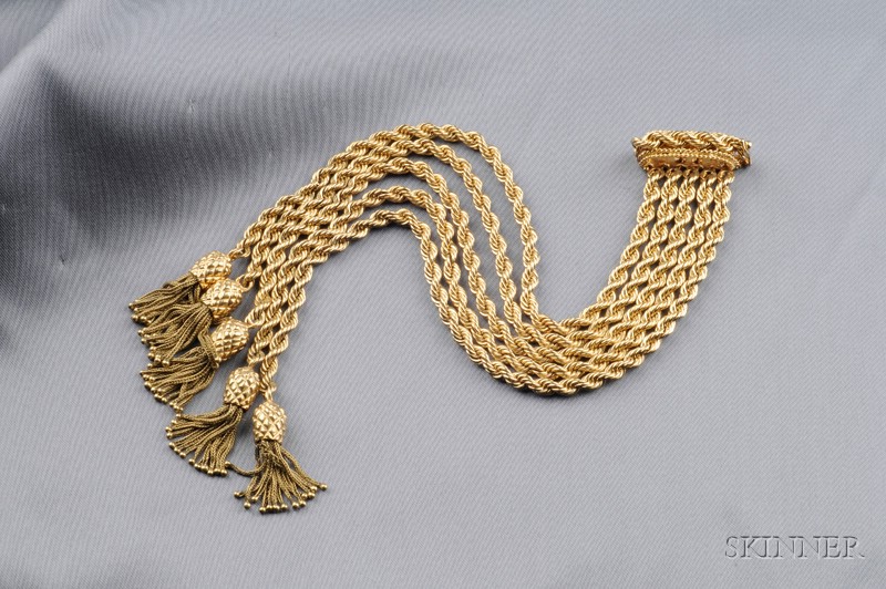 Appraisal: kt Gold Bracelet the multiple braided chains ending in tassels