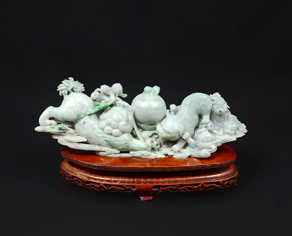 Appraisal: CHINESE CARVED JADEITE FOO DOGS FIGURAL GROUP Apple green and