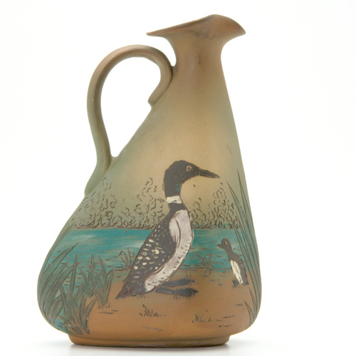 Appraisal: WELLER Dickensware ewer decorated with ducks along a riverbank Incised