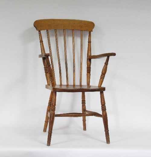 Appraisal: A Victorian stick back armchair on turned legs