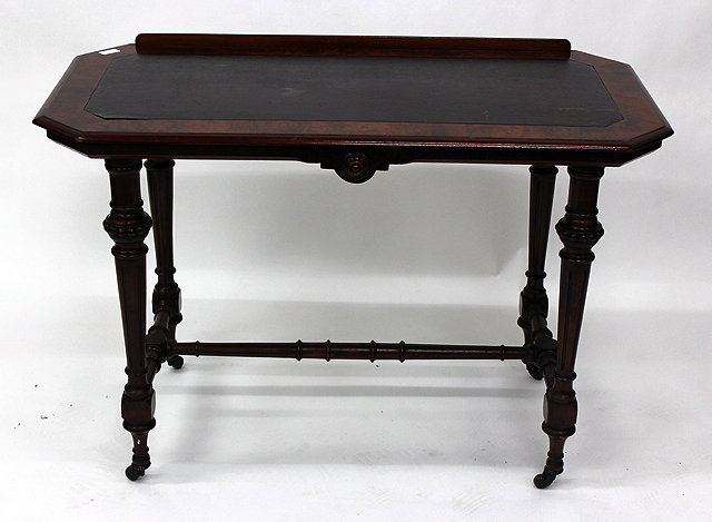 Appraisal: A VICTORIAN WALNUT WRITING TABLE with leatherette inset top canted