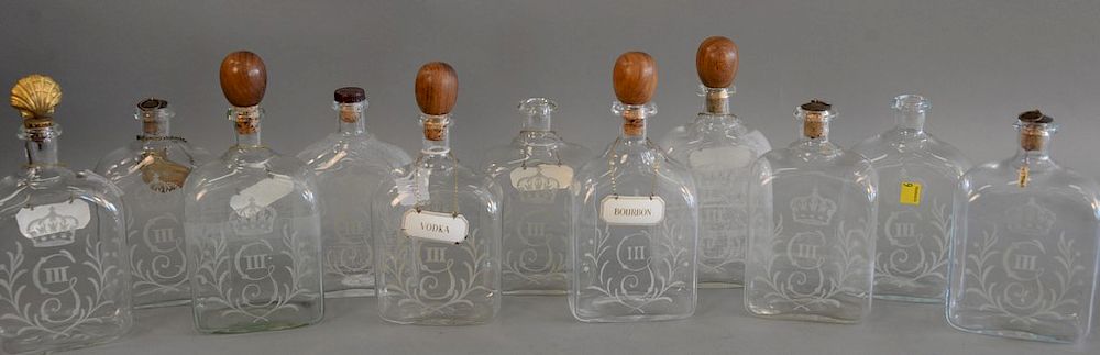 Appraisal: Group of eleven English etched glass decanters each with rectangular