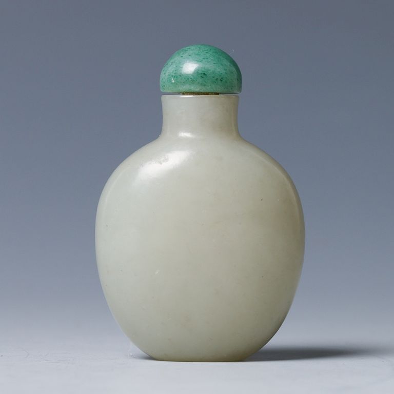 Appraisal: CELADON JADE SNUFF BOTTLE QING Of flattened ovoid body rising