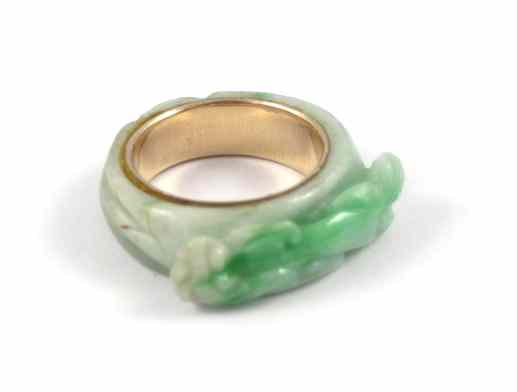 Appraisal: JADE AND FOURTEEN KARAT GOLD RING The Chinese ring with