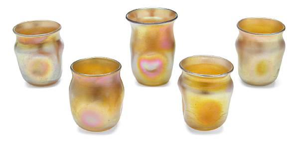 Appraisal: A group of five Tiffany Favrile glass dimpled miniature vases