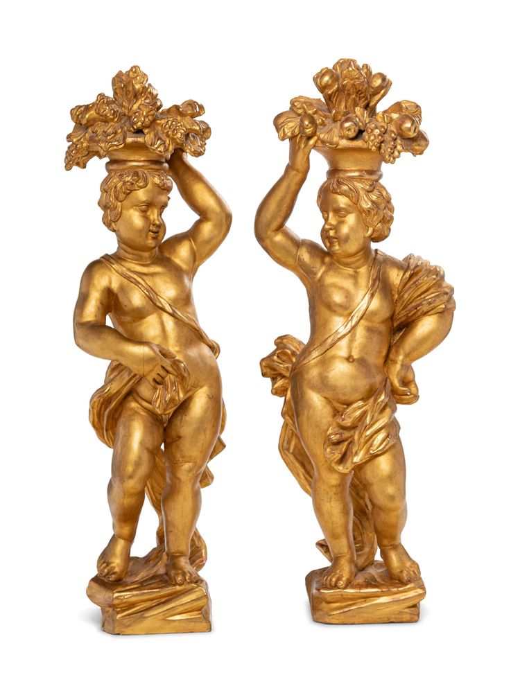 Appraisal: A Pair of Continental Carved Giltwood Putti Figures A Pair