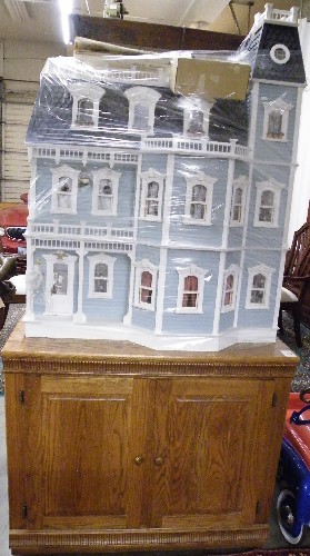 Appraisal: VICTORIAN STYLE DOLLHOUSE WITH ACCESSORIES AND CABINET FLOOR STAND The