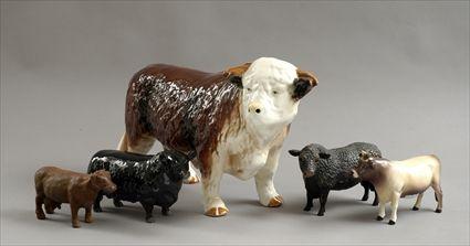 Appraisal: Five Pottery Porcelain Carved Wood and Cast-Metal Cow and Bull