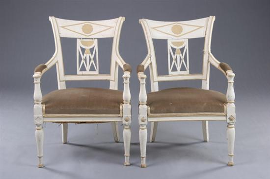 Appraisal: PAIR FRENCH PROVINCIAL EMPIRE FAUTEUILS th century Backswept crest rail