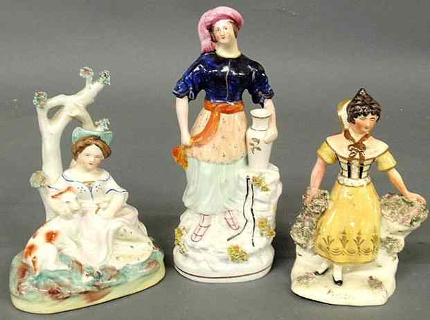 Appraisal: Three th c Staffordshire figures including a water girl with