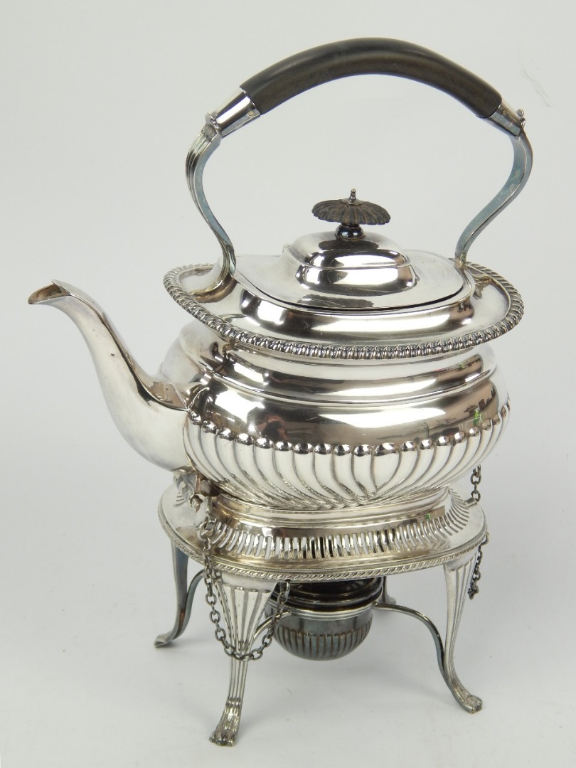 Appraisal: A silver plated tea kettle of semi fluted design with