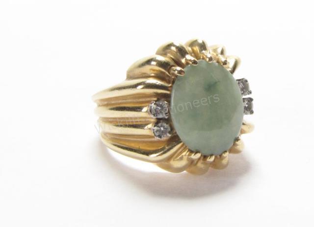 Appraisal: A K yellow gold ring with oval jadeite center approximately